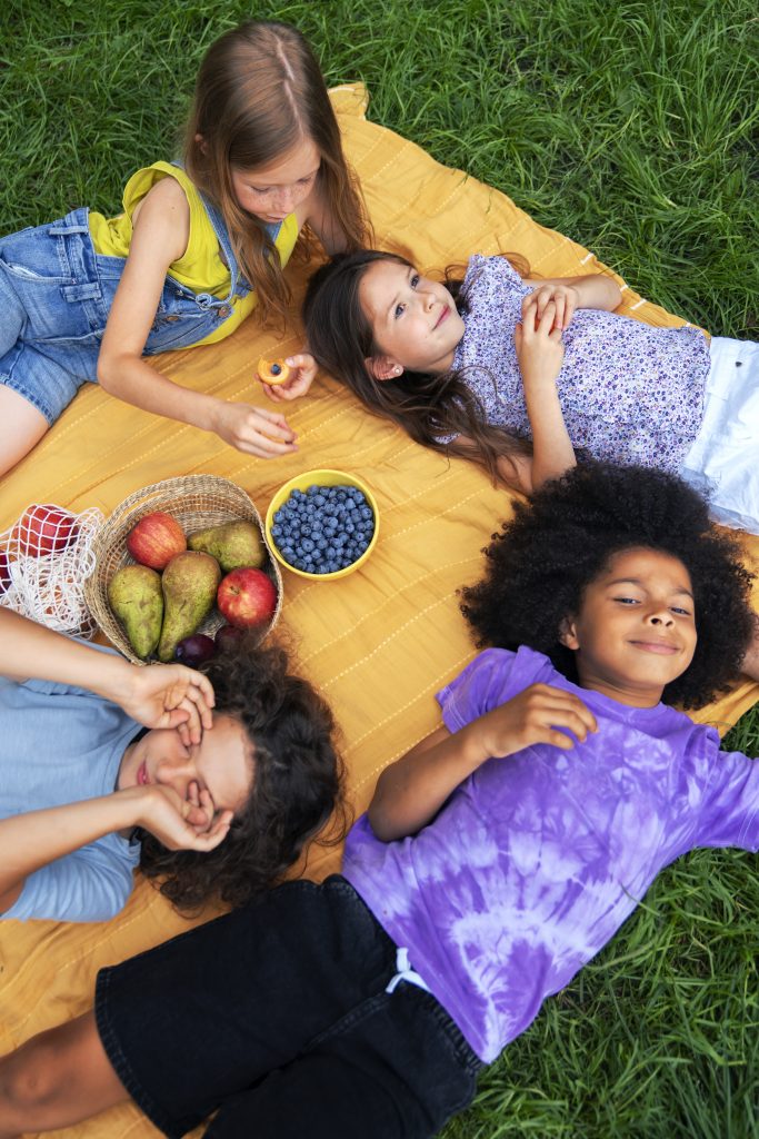 kids laying cloth high angle
